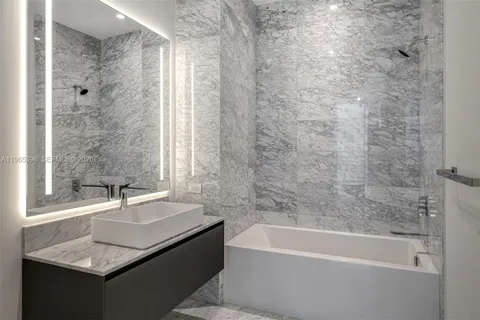 a bathroom with a sink and a bathtub