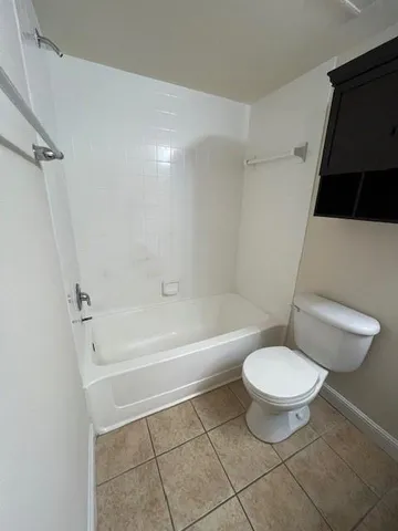 a bathroom with a toilet a sink and a bathtub
