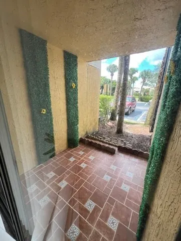 a view of a room with wooden floor and walls