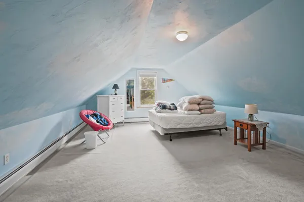 a bedroom with furniture and a couch