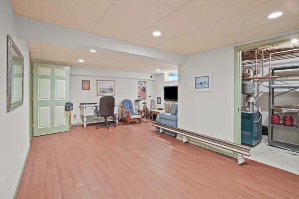a view of a livingroom with workspace and a window