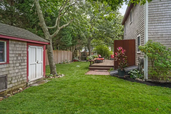 a house view with a sitting space and garden