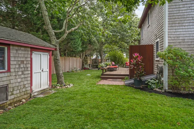 a house view with a sitting space and garden