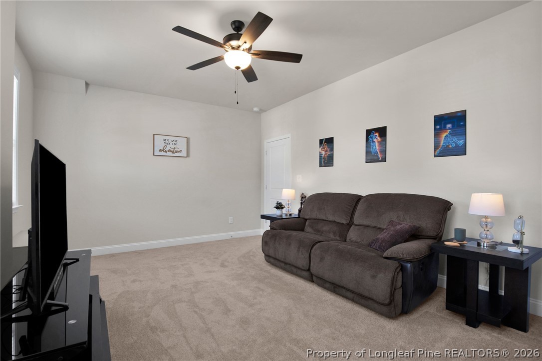 224 Timber Skip Drive Spring Lake, NC 28390 - Photo 17 of 30 a living room with furniture and a flat screen tv