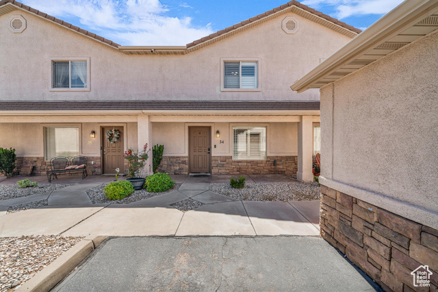 316 South 2450th Street East, Unit 34 St. George, UT 84790 - Photo 1 of 1 Property entrance featuring stone siding, covered porch, and stucco siding