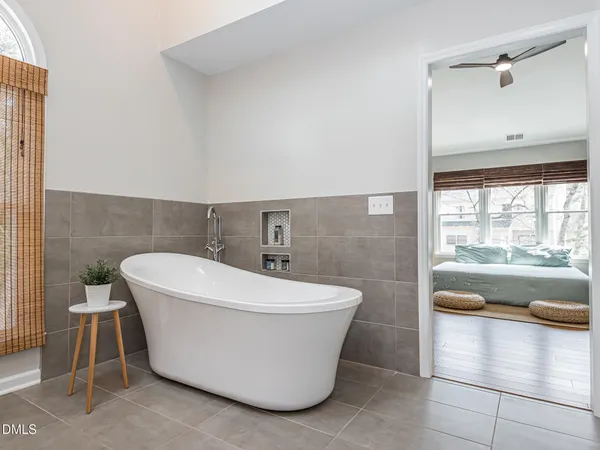 a white bath tub sitting in a bathroom