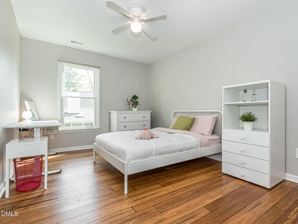 a room with lots of white furniture and closet