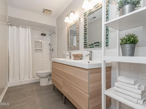a bedroom with furniture and wooden floor