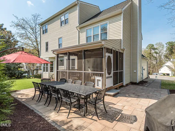 a view of a backyard with sitting area