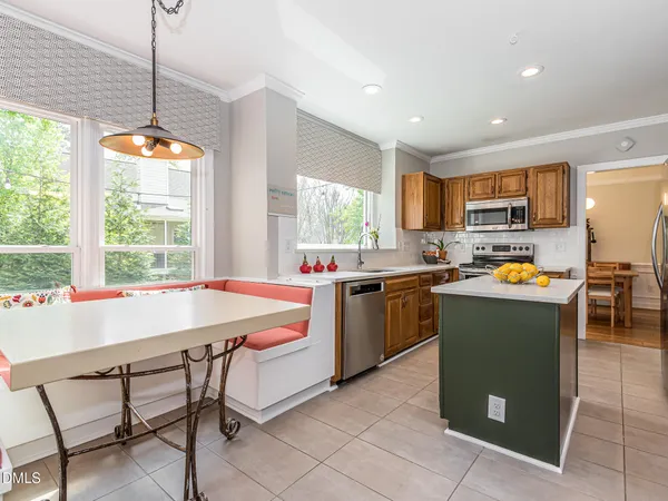 a kitchen with a sink and a stove top oven