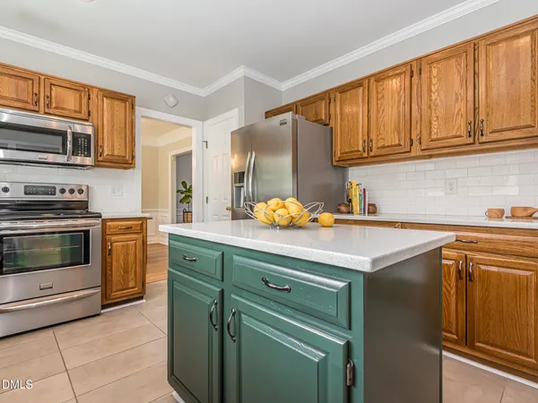 a dining room with a window and chairs