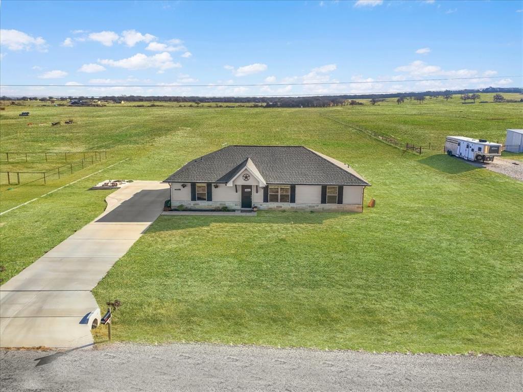 3797 Pine Road Poolville, TX 76487 - Photo 22 of 22 a view of a house with a yard