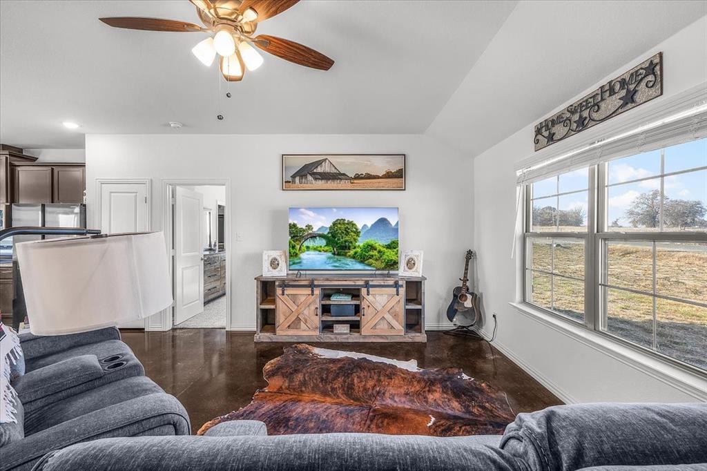 3797 Pine Road Poolville, TX 76487 - Photo 4 of 22 a living room with furniture and a large window