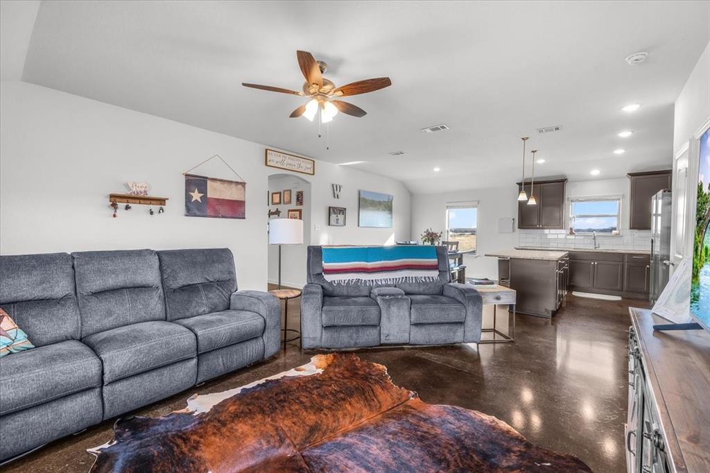 3797 Pine Road Poolville, TX 76487 - Photo 5 of 22 a living room with furniture and kitchen view