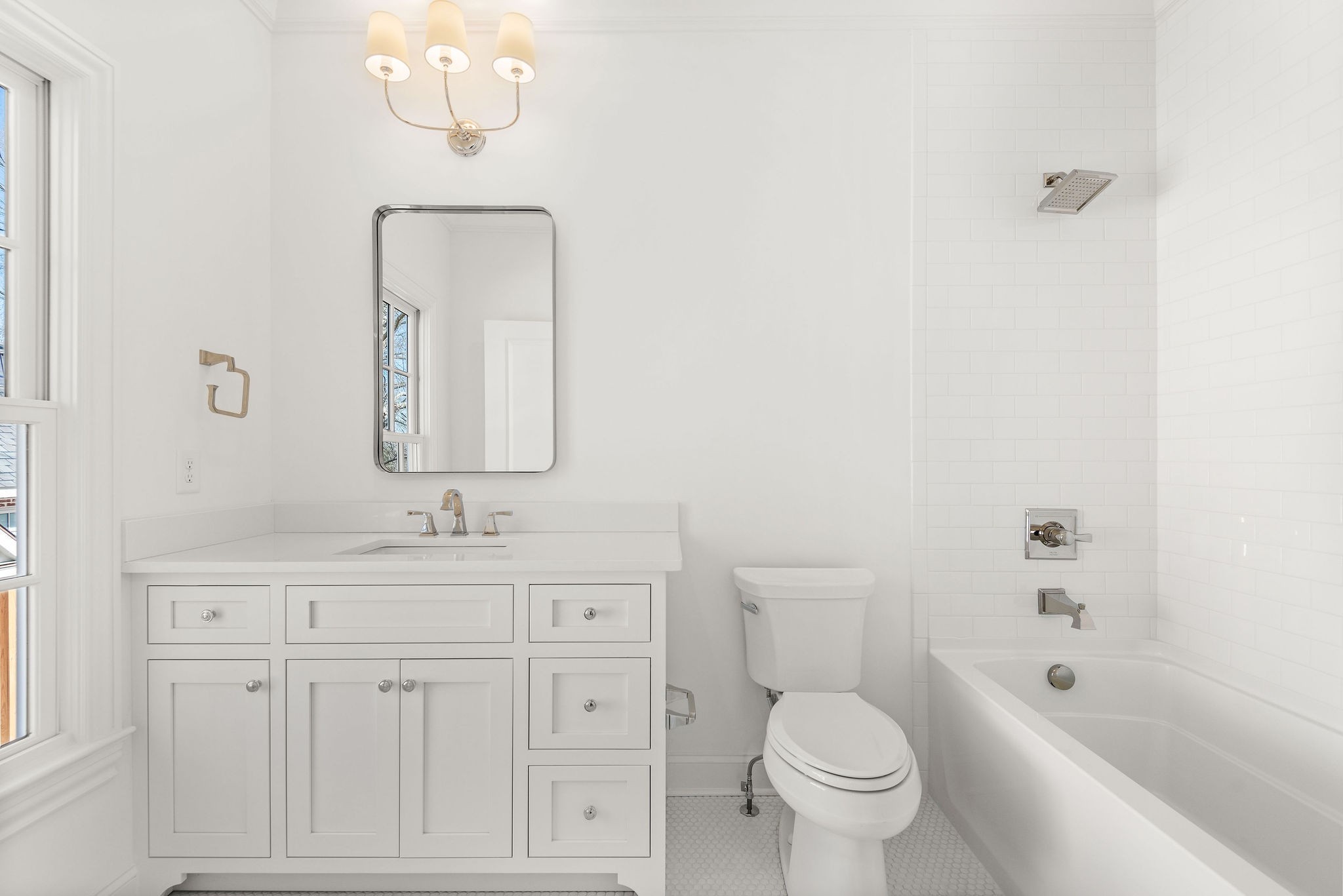 4338 Sneed Road Nashville, TN 37215 - Photo 31 of 46 a bathroom with a toilet a sink a tub and mirror