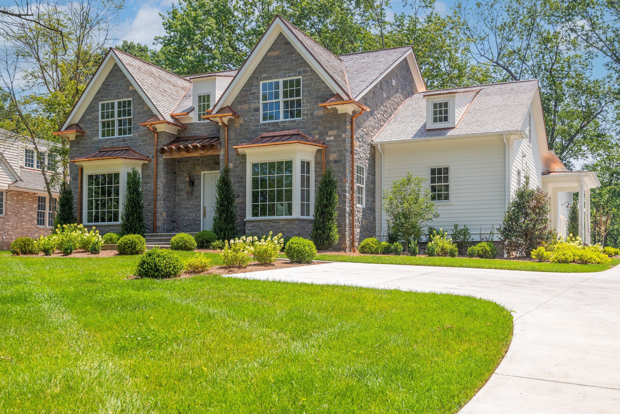 4338 Sneed Road Nashville, TN 37215 - Photo 4 of 46 a front view of a house with a yard and potted plants