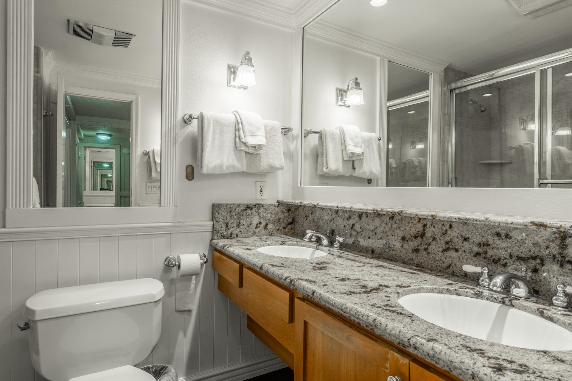 165 Old Mammoth Road, Unit 3 Mammoth Lakes, CA 93546 - Photo 22 of 48 Double vanity featuring granite countertops, undermount sinks, and wood cabinetry