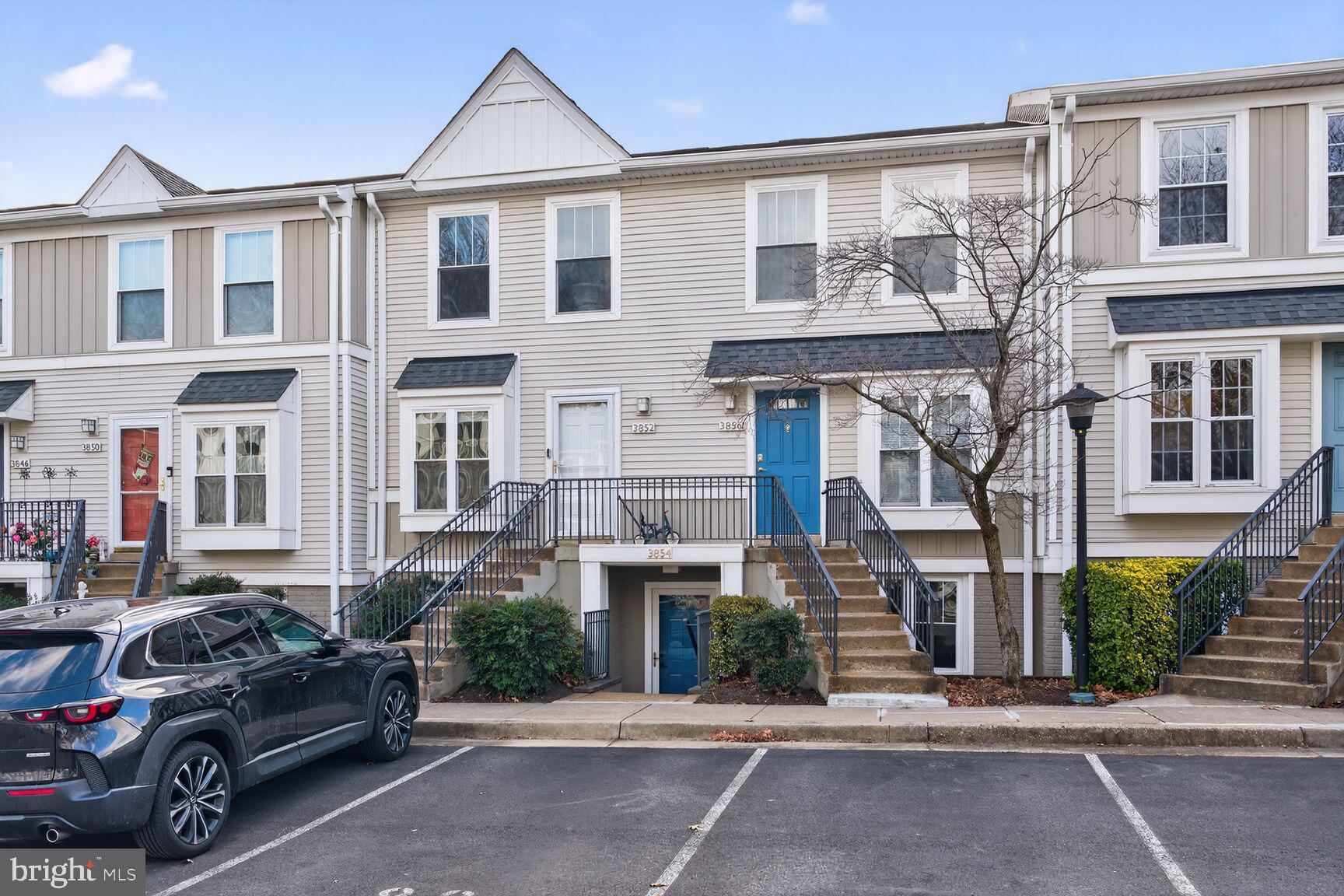 3854 9th Road South, Unit 3854 Arlington, VA 22204 - Photo 1 of 31 a front view of a residential apartment building with a yard