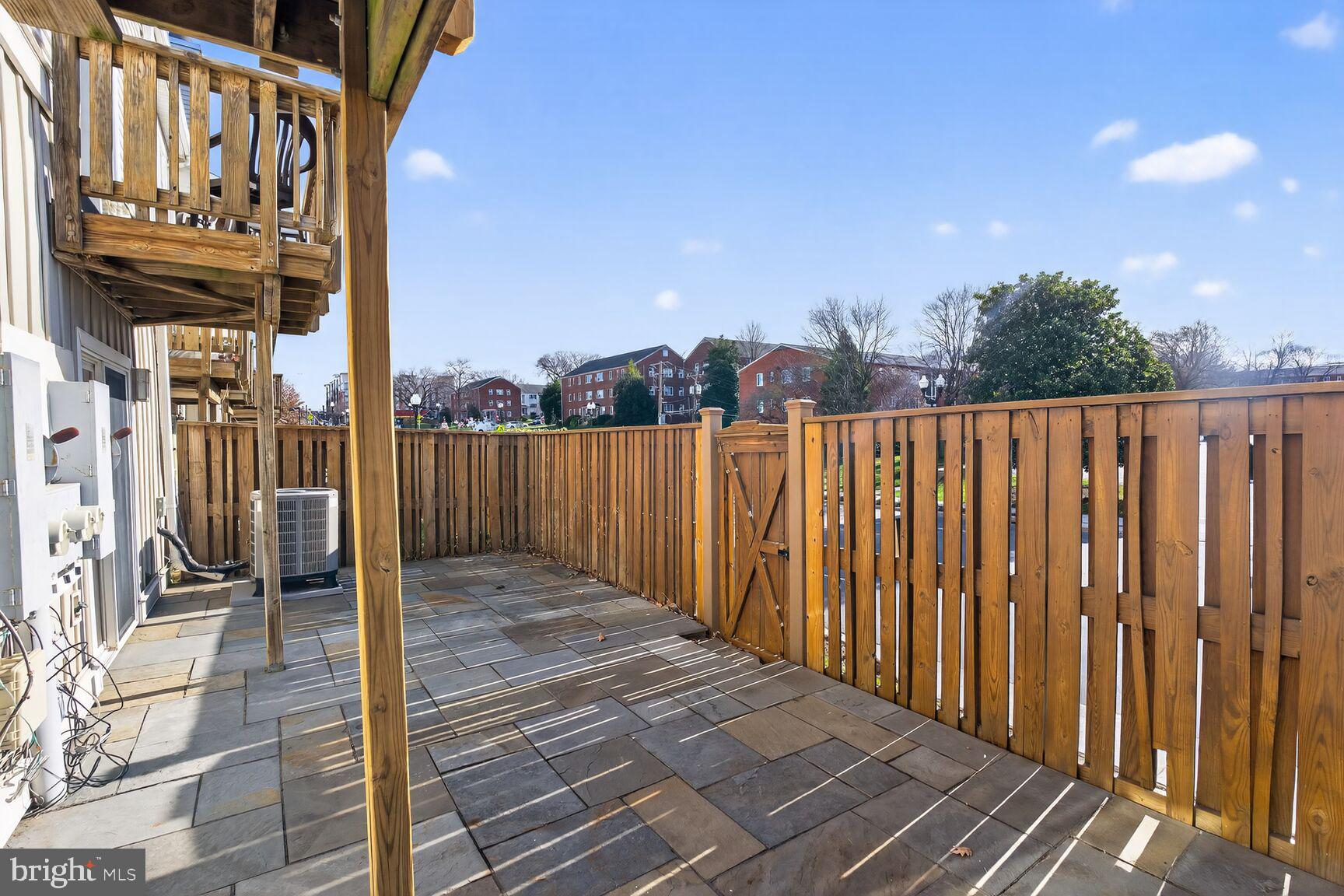 3854 9th Road South, Unit 3854 Arlington, VA 22204 - Photo 30 of 31 a view of a pathway of a building with wooden fence