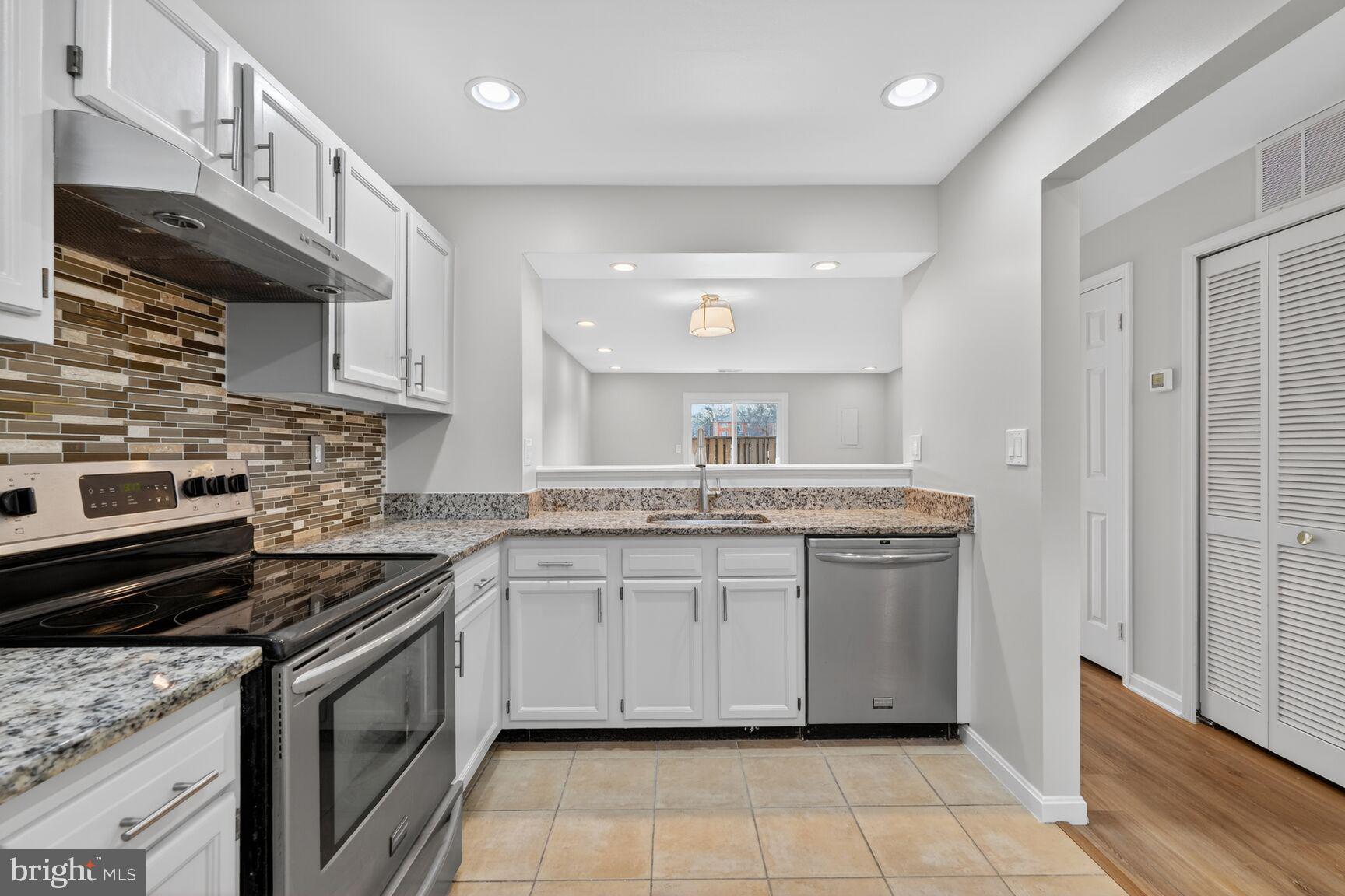 3854 9th Road South, Unit 3854 Arlington, VA 22204 - Photo 9 of 31 a kitchen with stainless steel appliances granite countertop a sink and a stove