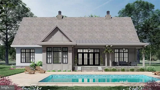 a kitchen with stainless steel appliances granite countertop a table chairs and a refrigerator