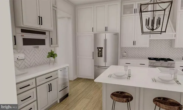 a kitchen with stainless steel appliances granite countertop a sink and a stove