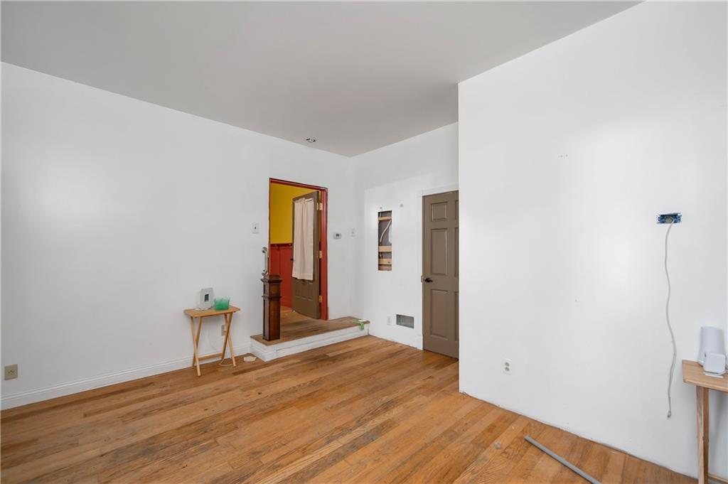 438 Main Street Prospect, PA 16052 - Photo 18 of 46 a view of an empty room with wooden floor and closet