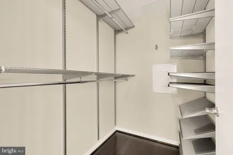a view of storage and utility room with racks on the wall