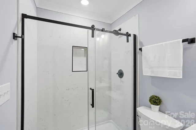 a bathroom with a shower and a shower