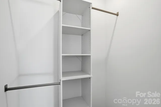a view of an empty walk in closet