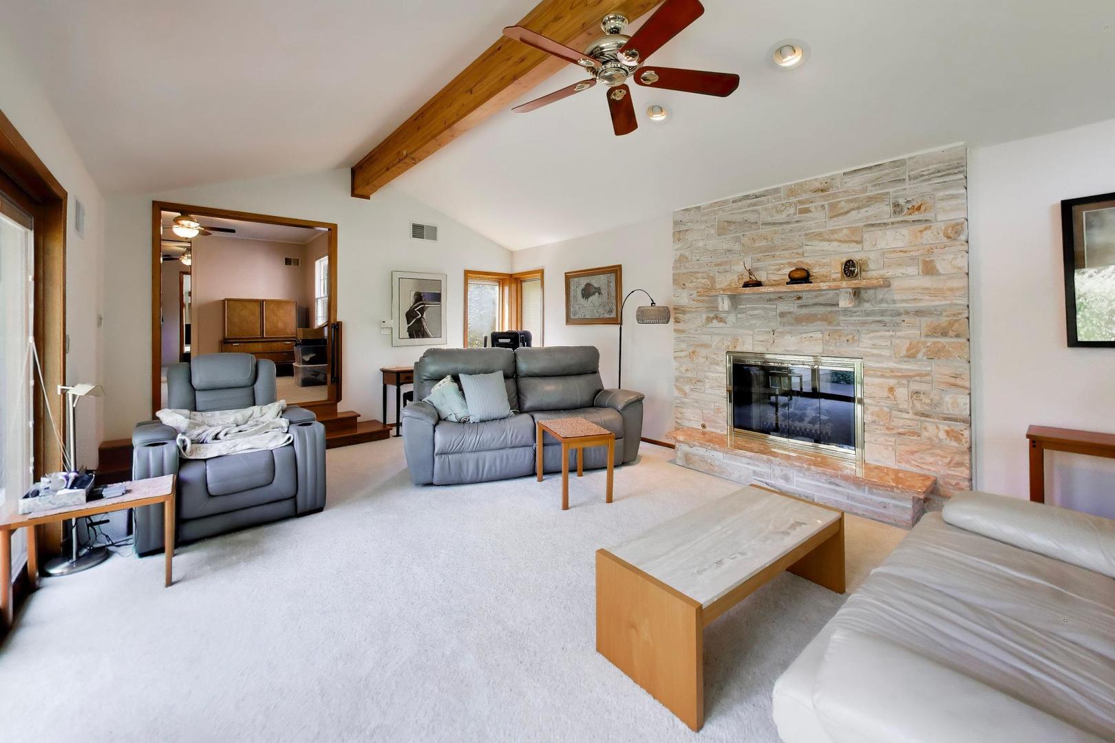 103 Cottonwood Road Northbrook, IL 60062 - Photo 15 of 50 a living room with furniture and a fireplace