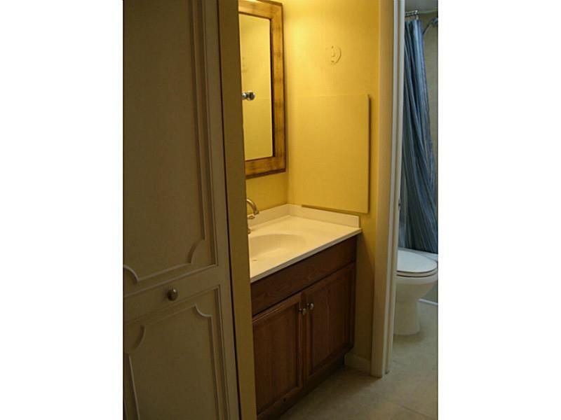 3750 Inverrary Drive, Unit 2Q Lauderhill, FL 33319 - Photo 3 of 16 a bathroom with a sink and a mirror