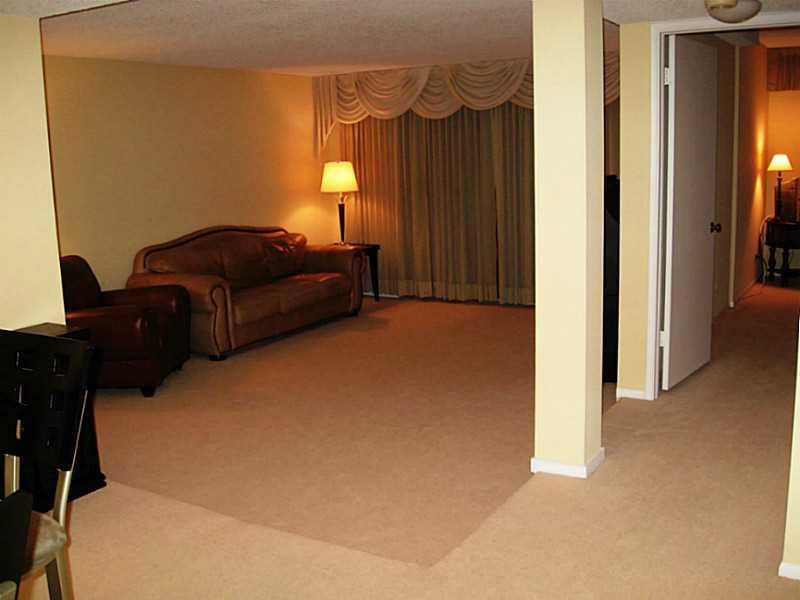 3750 Inverrary Drive, Unit 2Q Lauderhill, FL 33319 - Photo 10 of 16 a bedroom with a bed and a window