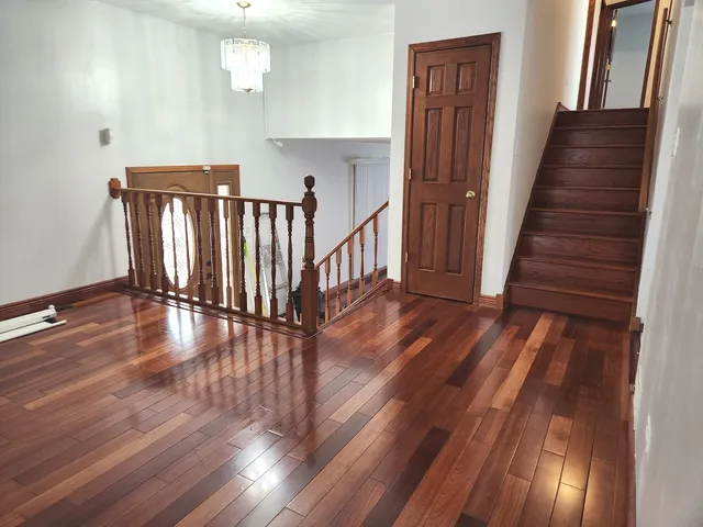 a view of entryway with wooden floor
