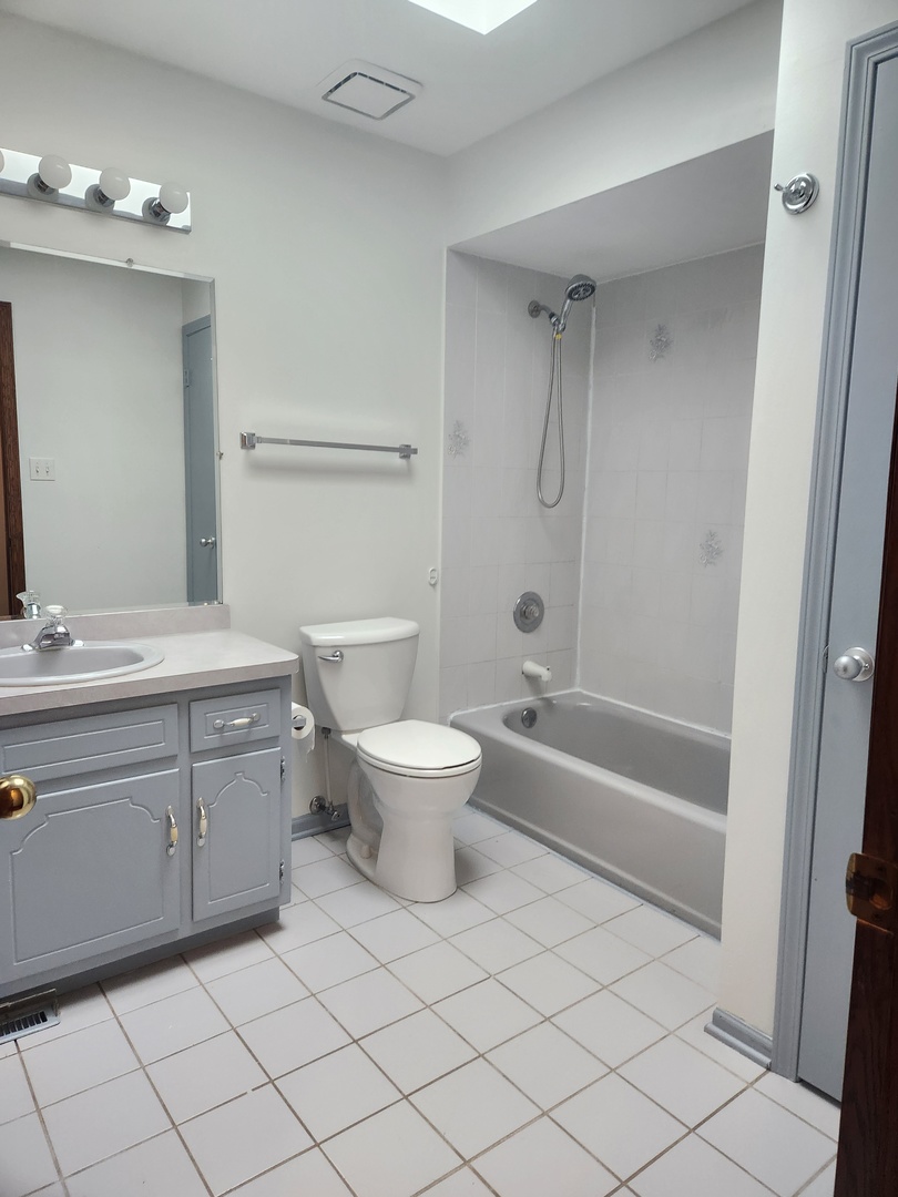 11723 South Ave J Chicago, IL 60617 - Photo 18 of 32 a bathroom with a sink toilet and shower