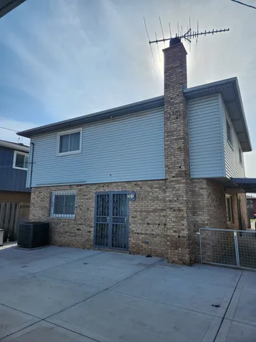 a front view of a house with parking space