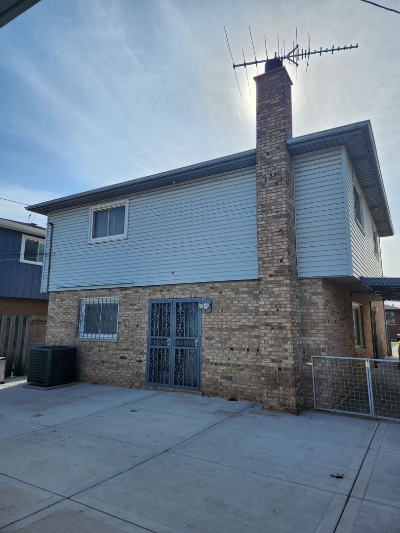 11723 South Ave J Chicago, IL 60617 - Photo 30 of 32 a front view of a house with parking space