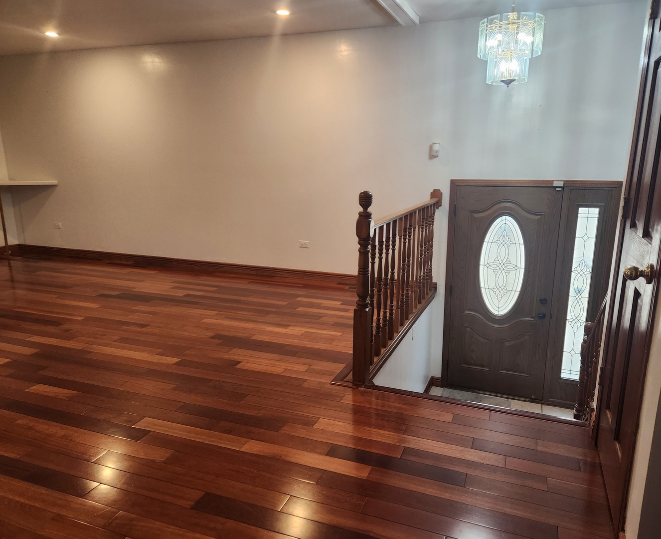 11723 South Ave J Chicago, IL 60617 - Photo 3 of 32 a view of a room with wooden floor and white walls