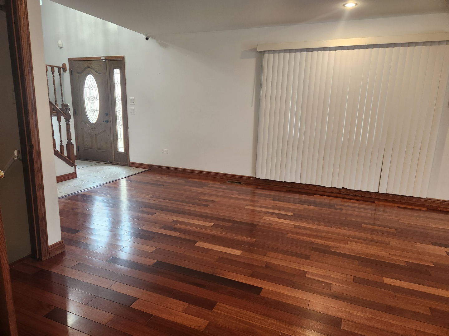 11723 South Ave J Chicago, IL 60617 - Photo 6 of 32 a view of a hallway with wooden floor