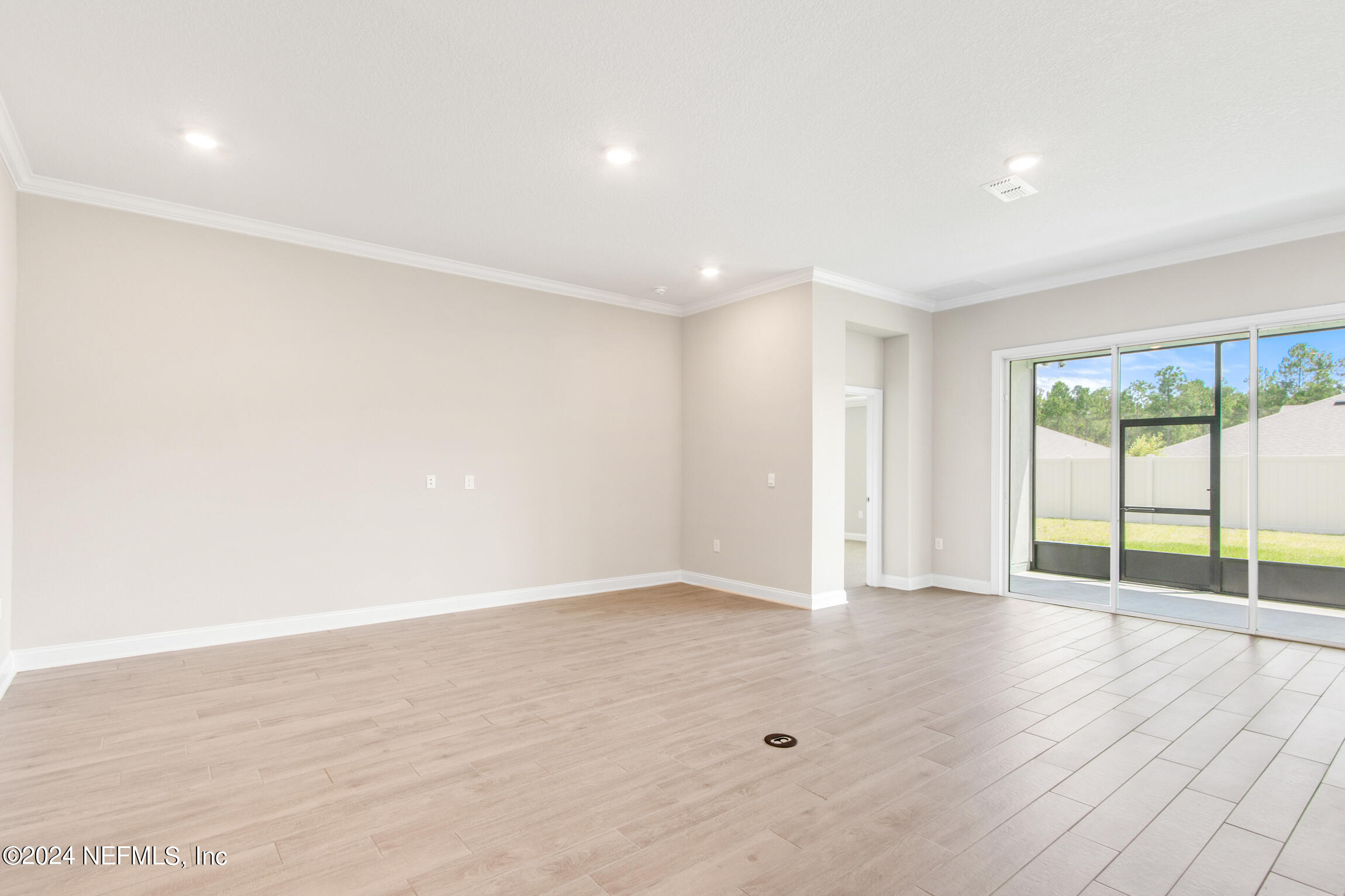 254 Ebro Road St. Augustine, FL 32084 - Photo 14 of 49 wooden floor in an empty room with a window