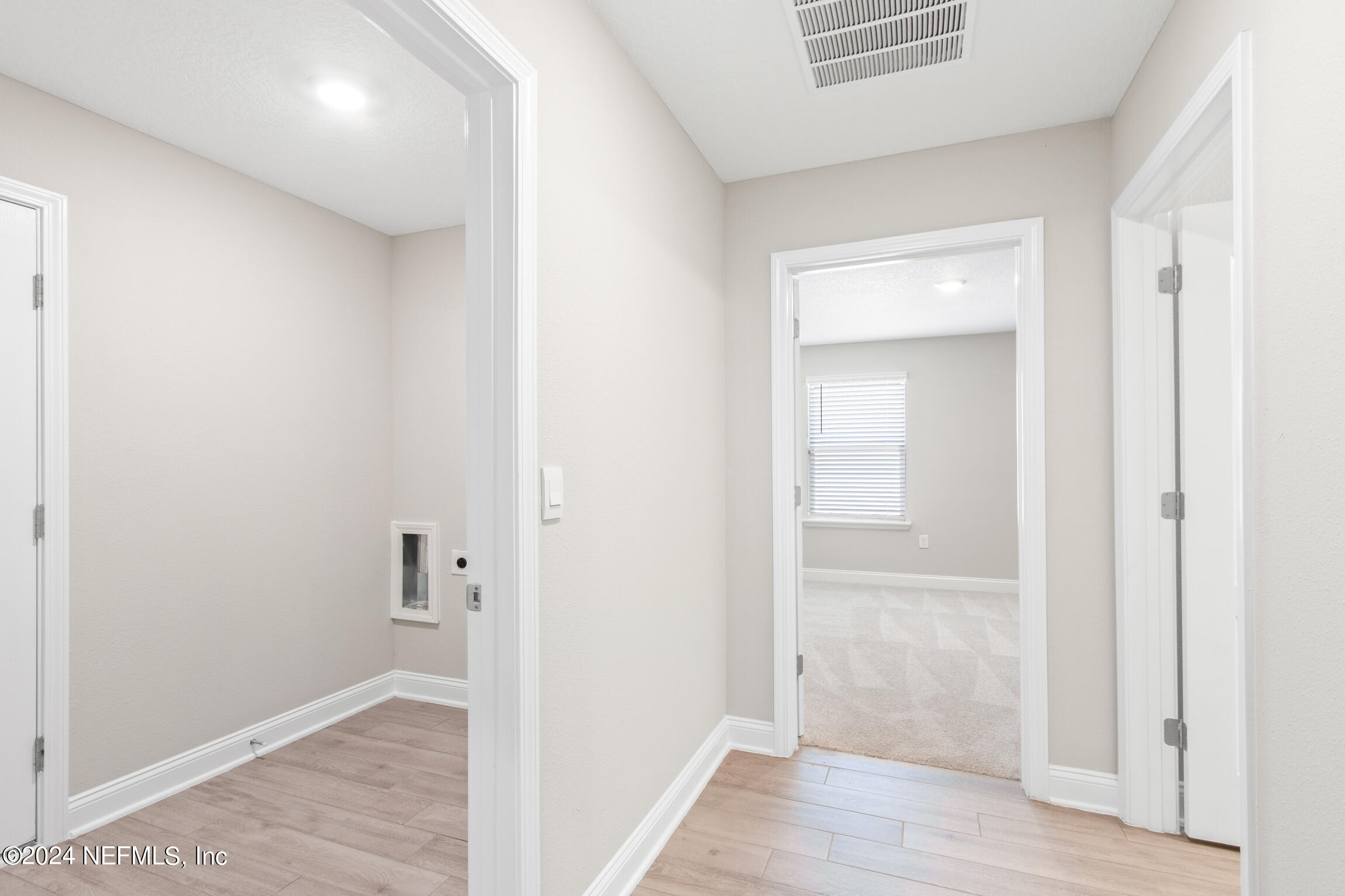 254 Ebro Road St. Augustine, FL 32084 - Photo 22 of 49 a view of a hallway with wooden floor