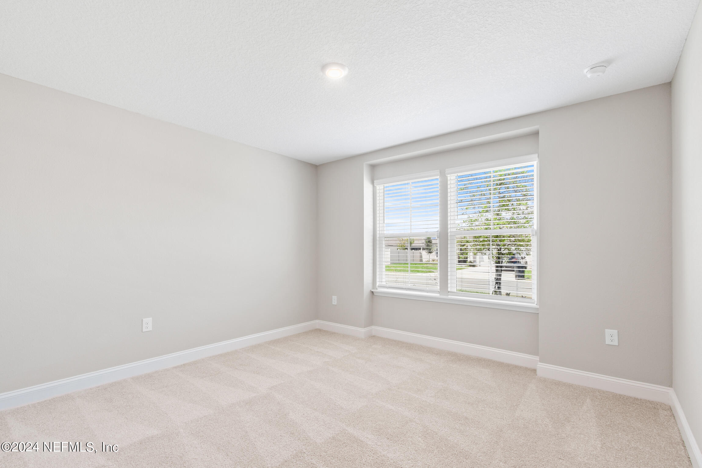 254 Ebro Road St. Augustine, FL 32084 - Photo 27 of 49 an empty room with windows