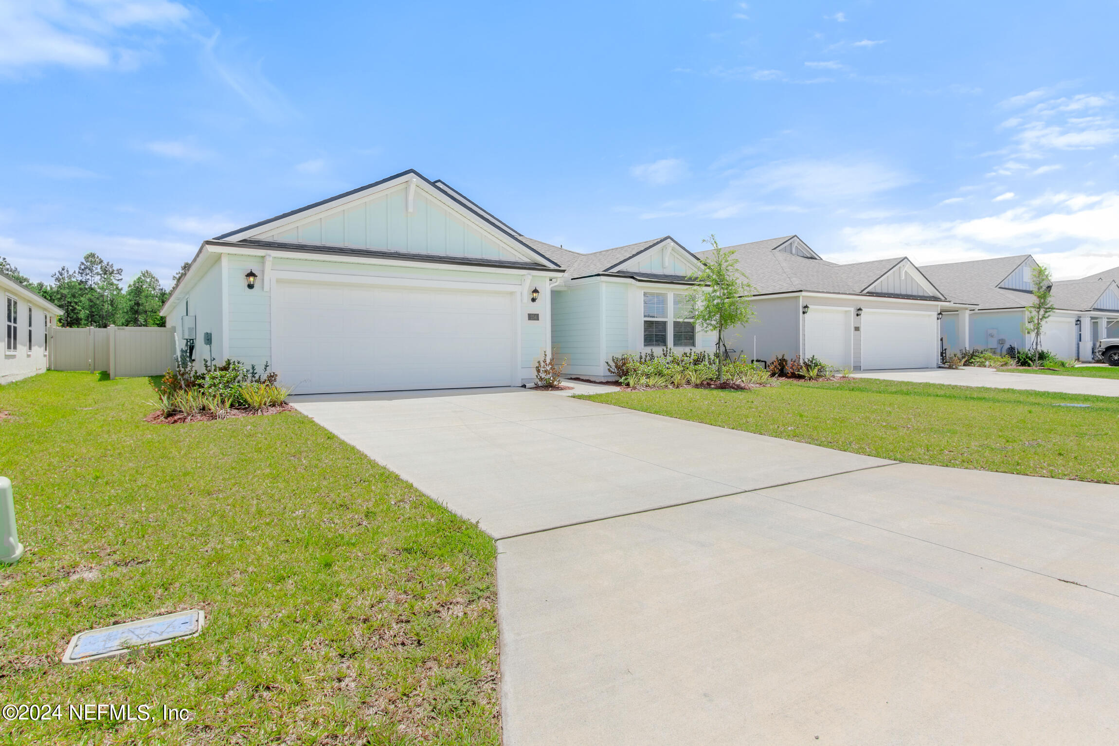 254 Ebro Road St. Augustine, FL 32084 - Photo 37 of 49 a front view of a house with a yard and garage