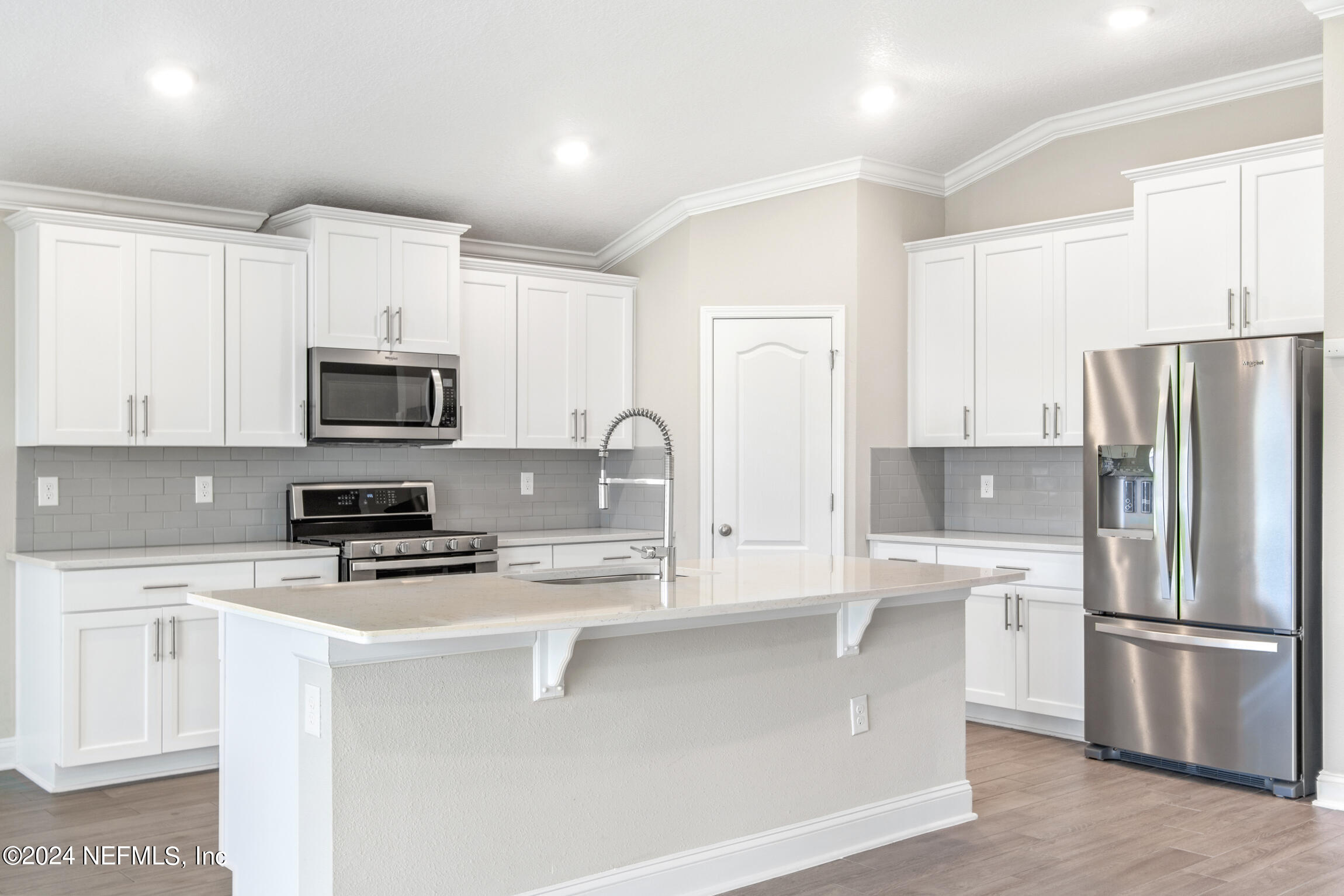 254 Ebro Road St. Augustine, FL 32084 - Photo 5 of 49 a kitchen with stainless steel appliances a refrigerator stove microwave and sink