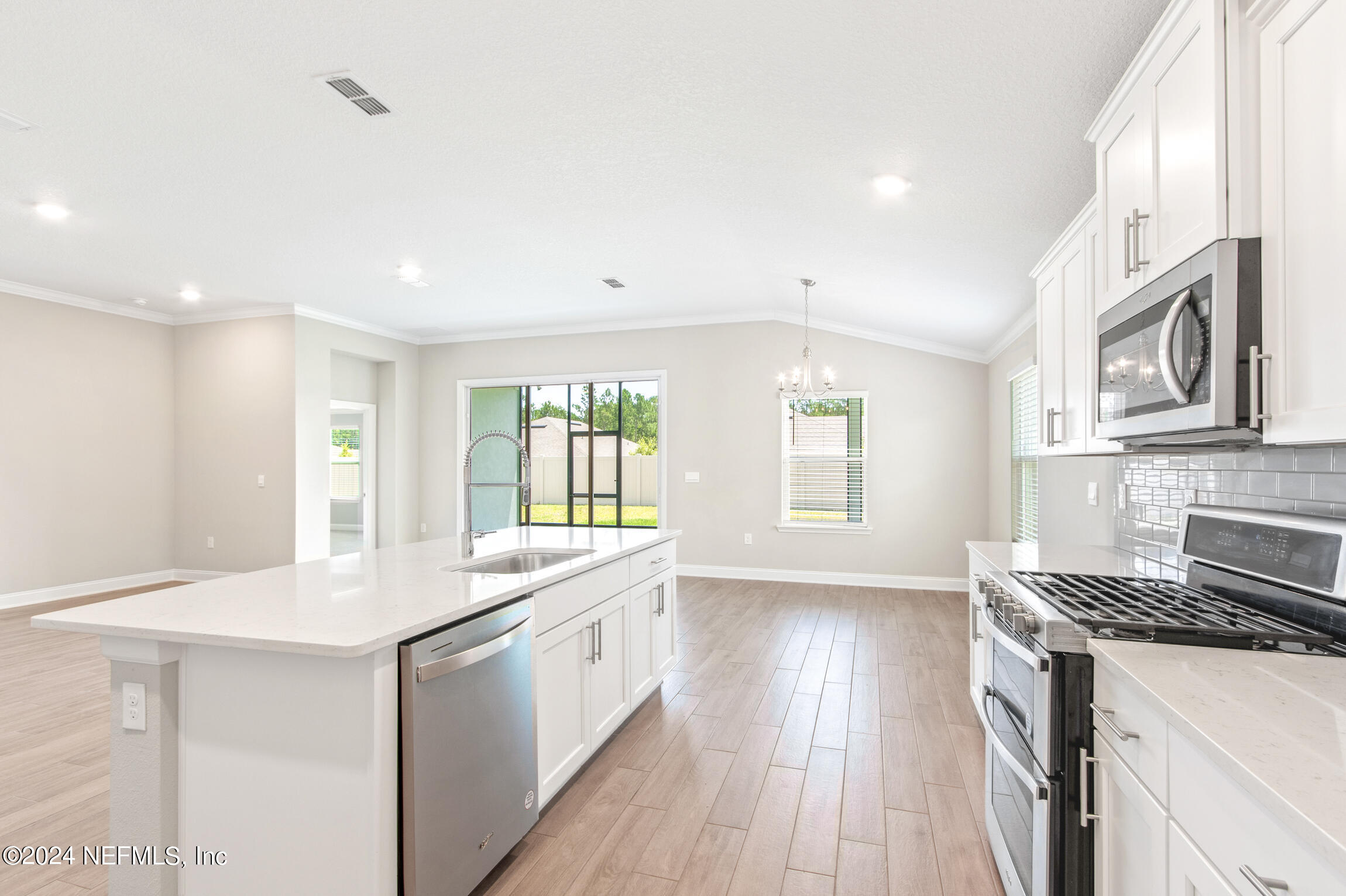 254 Ebro Road St. Augustine, FL 32084 - Photo 9 of 49 a kitchen with a sink stove and cabinets