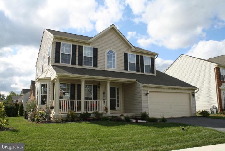 5627 New Forge Road White Marsh, MD 21162 - Photo 1 of 30 a front view of a house with a yard and trees