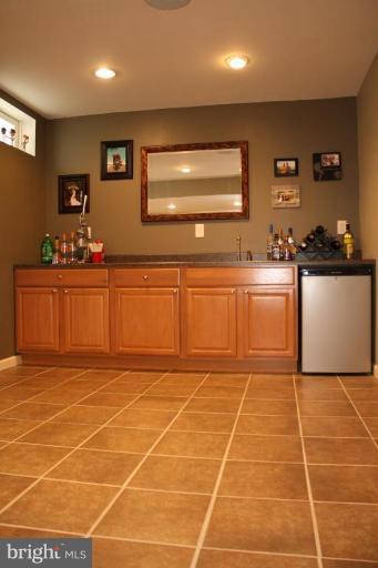5627 New Forge Road White Marsh, MD 21162 - Photo 19 of 30 a kitchen with stainless steel appliances a stove a sink and a cabinets