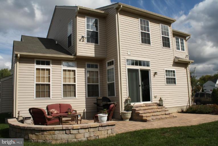 5627 New Forge Road White Marsh, MD 21162 - Photo 3 of 30 a front view of a house with a yard