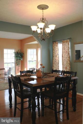 5627 New Forge Road White Marsh, MD 21162 - Photo 21 of 30 a view of a dining room with furniture window and wooden floor