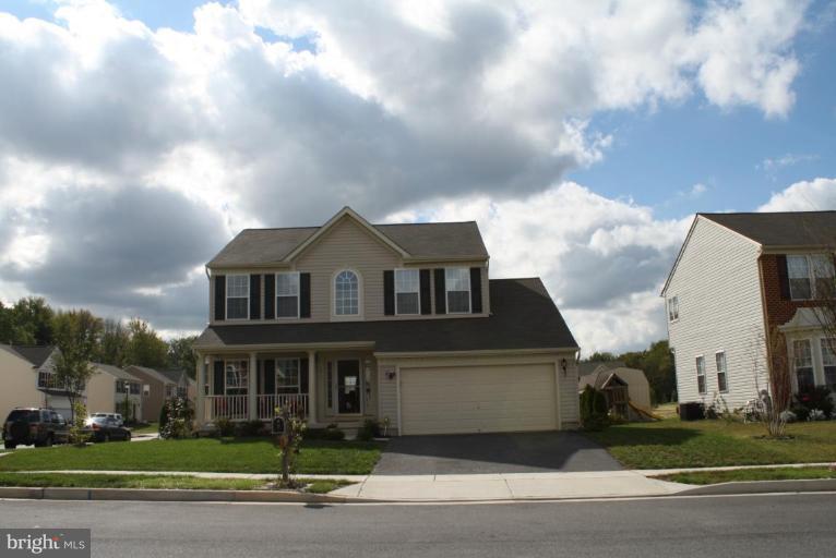 5627 New Forge Road White Marsh, MD 21162 - Photo 29 of 30 a front view of a house with a garden